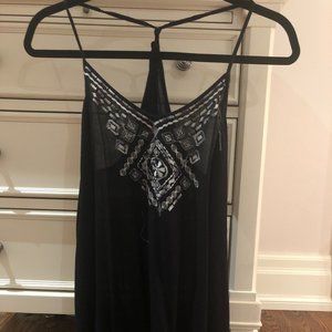 Black tank top with white embroidered neckline